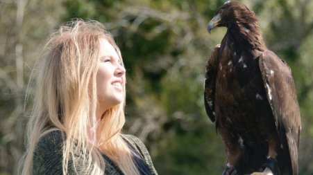 Sophie-Lee Williams with a Golden Eagle (falconry bird)
