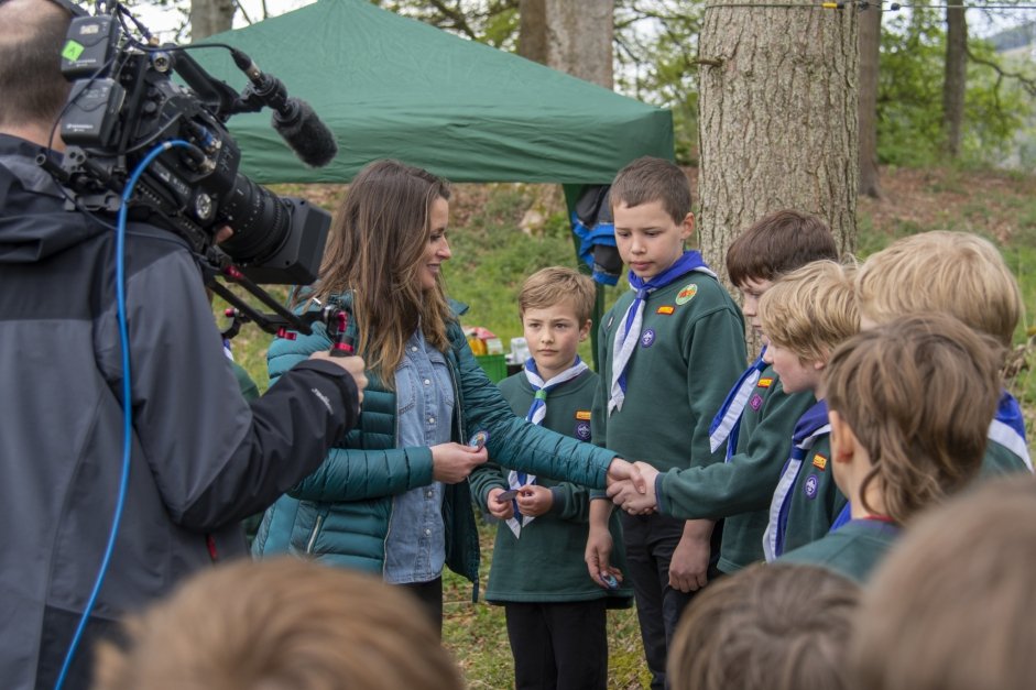 Cubs recieving their Eagle Champions badges from presenter Ann Lundon of BBC Scotland Landward
