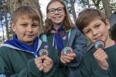 Proud Cubs displaying their badges
