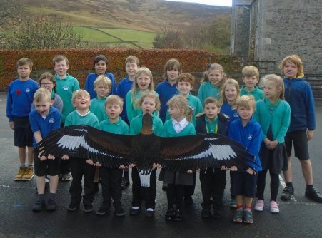 Students with Eagle cut-out