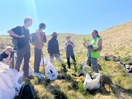 Students unpacking trees to be planted at Gameshope, owned and managed by Borders Forest Trust